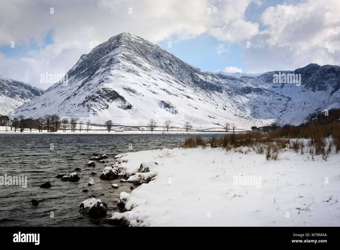 Buttermere lake in the English Lake District in winter, main fell / mountain in view is Fleetwith Pike Stock Photo