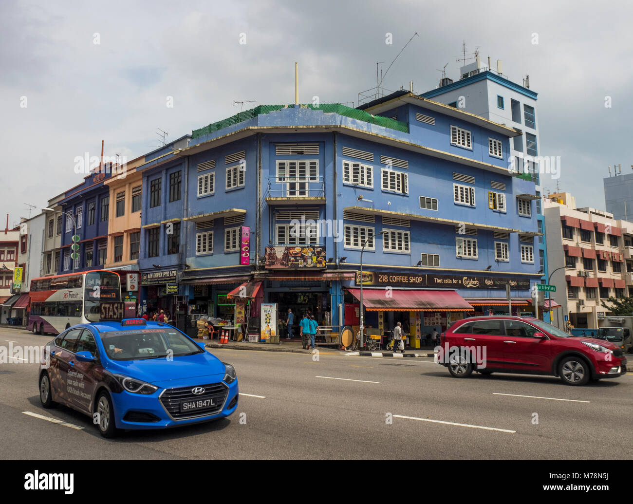 Streetscape and traffic on Geylang Road, Geylang, Singapore. Stock Photo