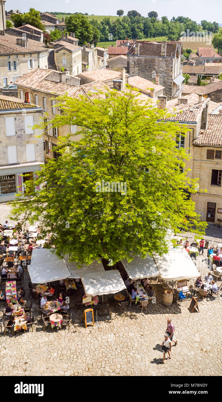 Bird's eye view of the market square of Saint-Emilion, a medieval city in the south-west of France renowned for wine and gastronomy, with restaurant t Stock Photo