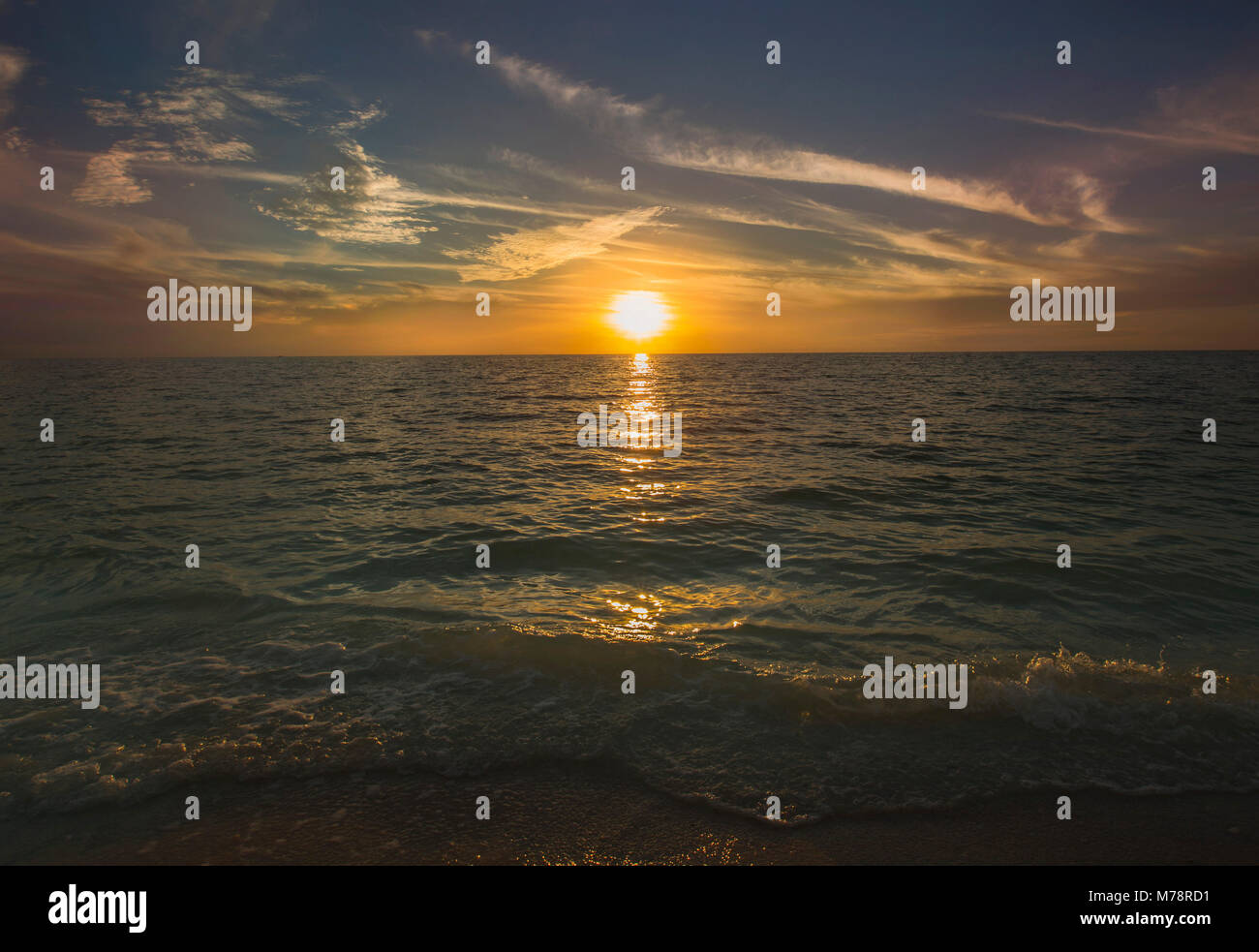 Sun Setting Over the Ocean in Naples, Florida Stock Photo