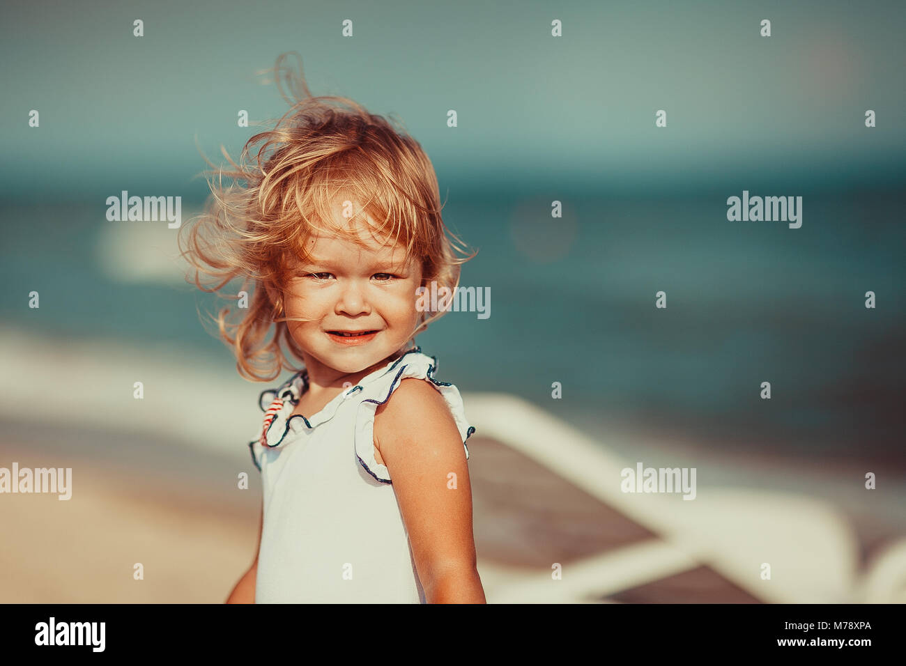 Portrait of a beautiful little girl looking at camera. Close-up Stock ...