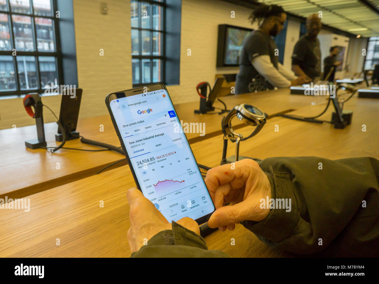 Visitors to the Samsung 837 showroom in the Meatpacking District in New York admire a Samsung Galaxy S9 Plus smartphone on Thursday, March 1, 2018. Samsung released their new Galaxy S9 and S9+ on February 25 with availability for purchase on March 16.  (© Richard B. Levine) Stock Photo
