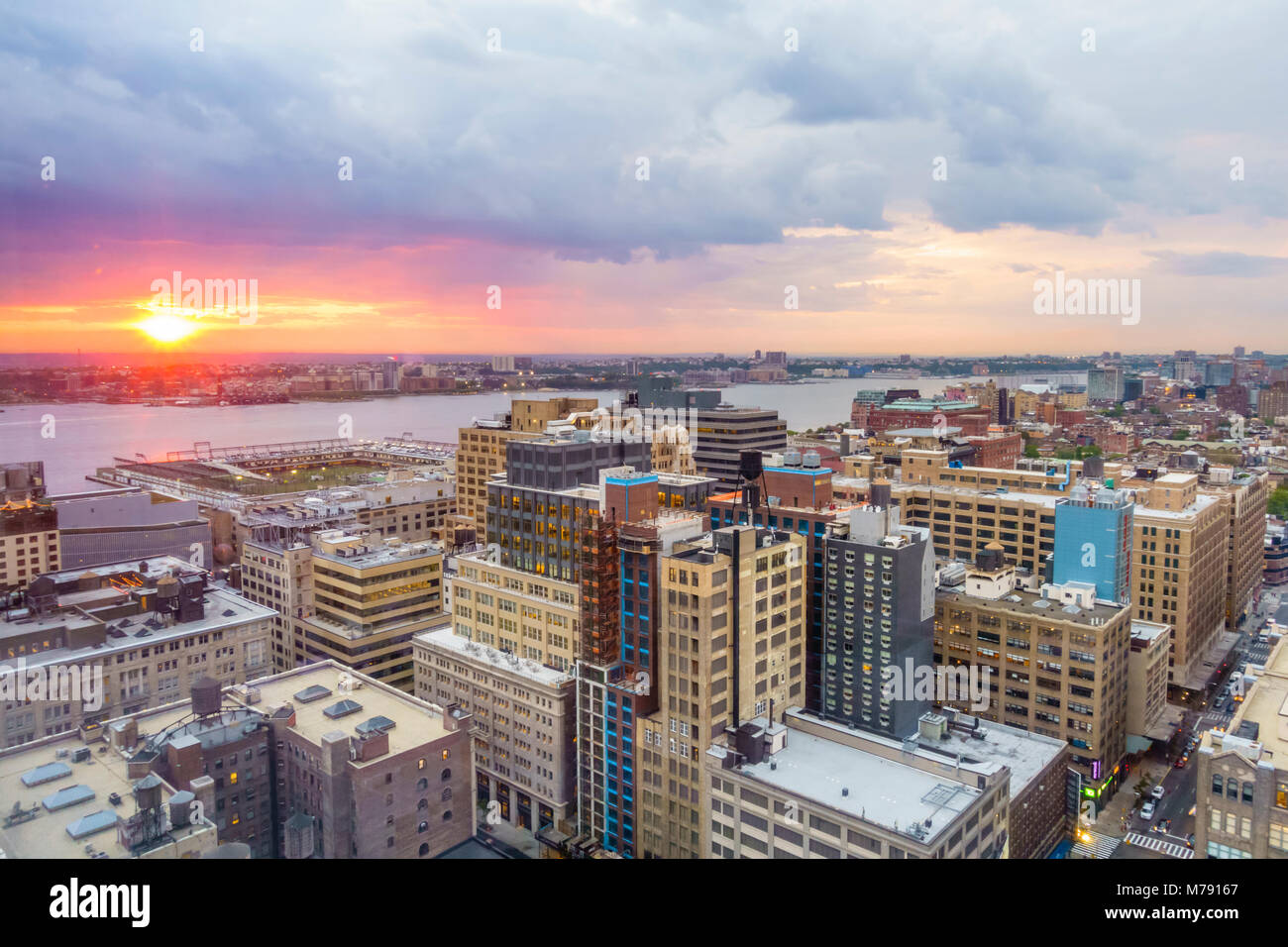 Sunset over New York skyline towards the Hudson River, Manhattan, New York City Stock Photo