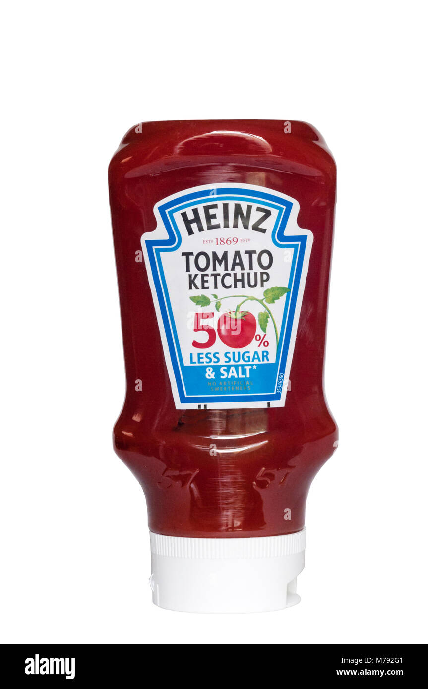 A squeezy plastic bottle of Heinz Tomato Ketchup with 50% less sugar & salt.  Designed to be stood upside down on its lid Stock Photo