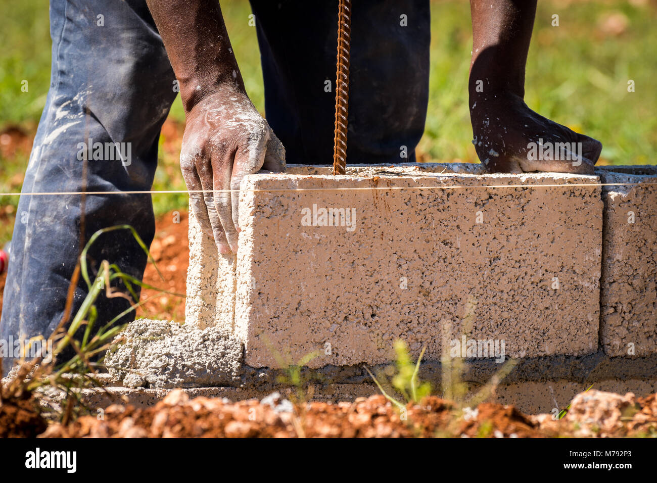 Cement Blocks being laid to build a wall on a Construction Site in the