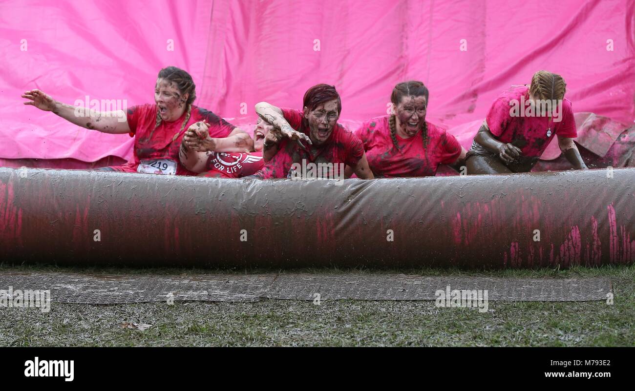 Women fight dirty at Race for Life Pretty Muddy in Hammersmith on Wednesday 13 July for Cancer Research UK Stock Photo