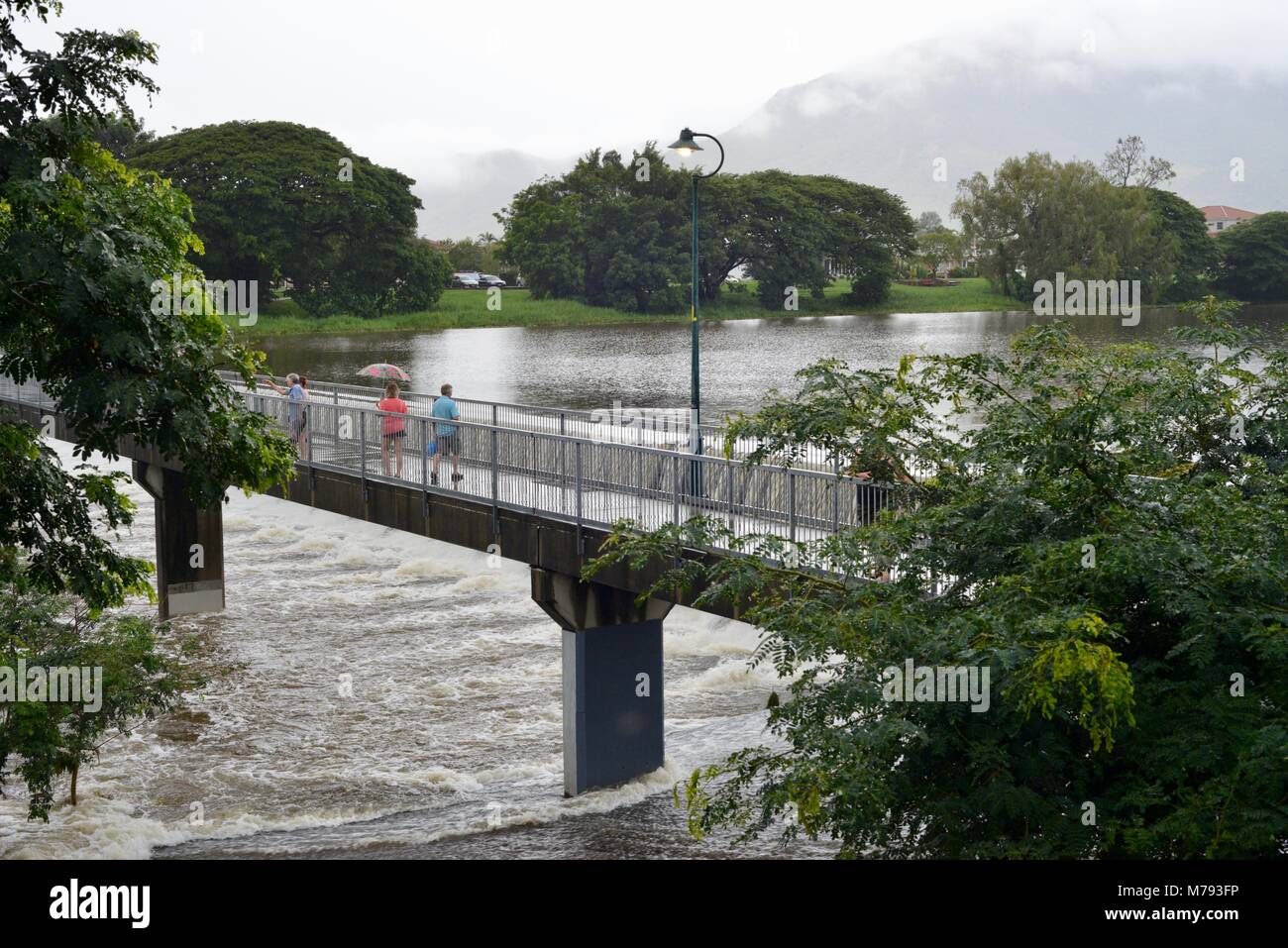 People come to see water cascading over Aplins weir after storms and
