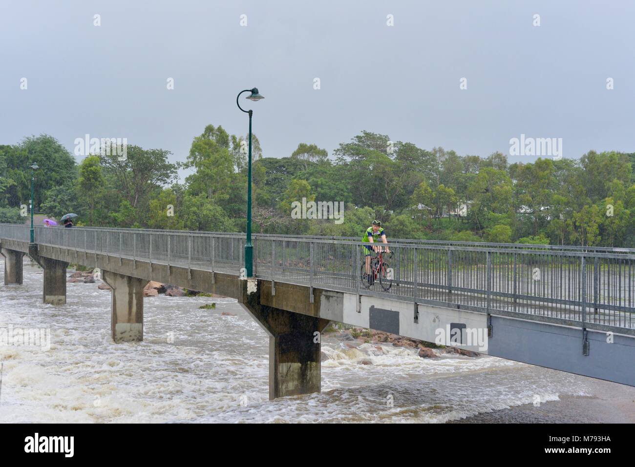 People come to see water cascading over Aplins weir after storms and