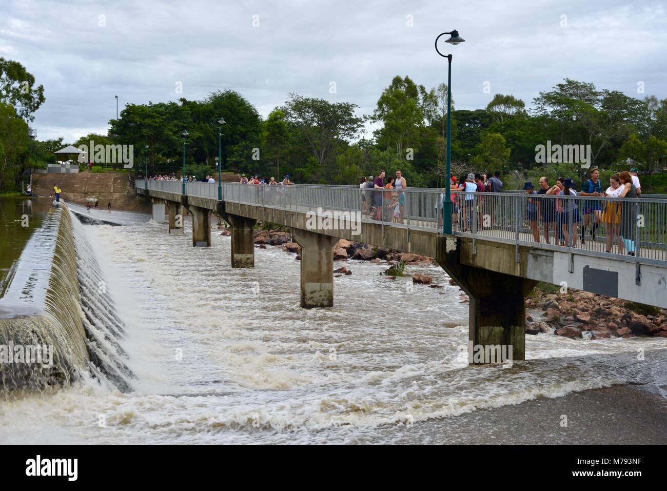 Crowds of people come to see water cascading over Aplins weir after