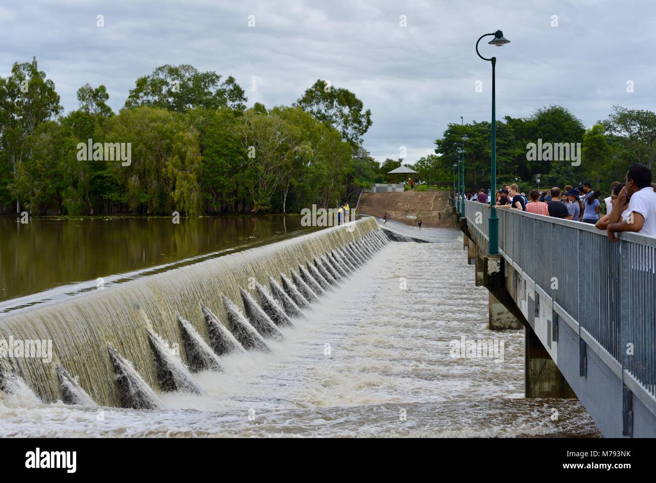Crowds of people come to see water cascading over Aplins weir after