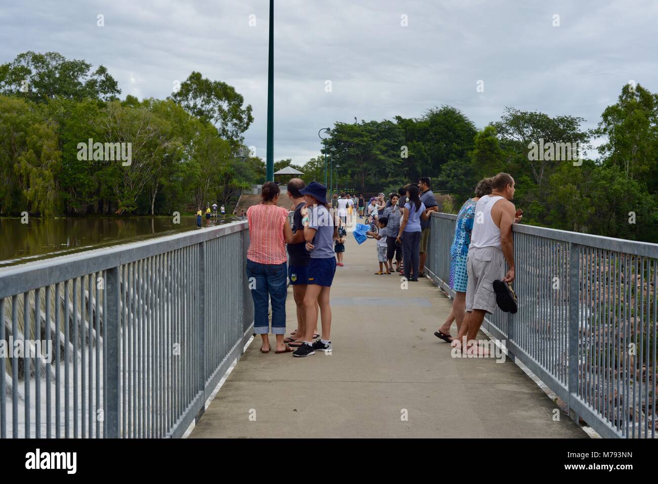 Crowds of people come to see water cascading over Aplins weir after