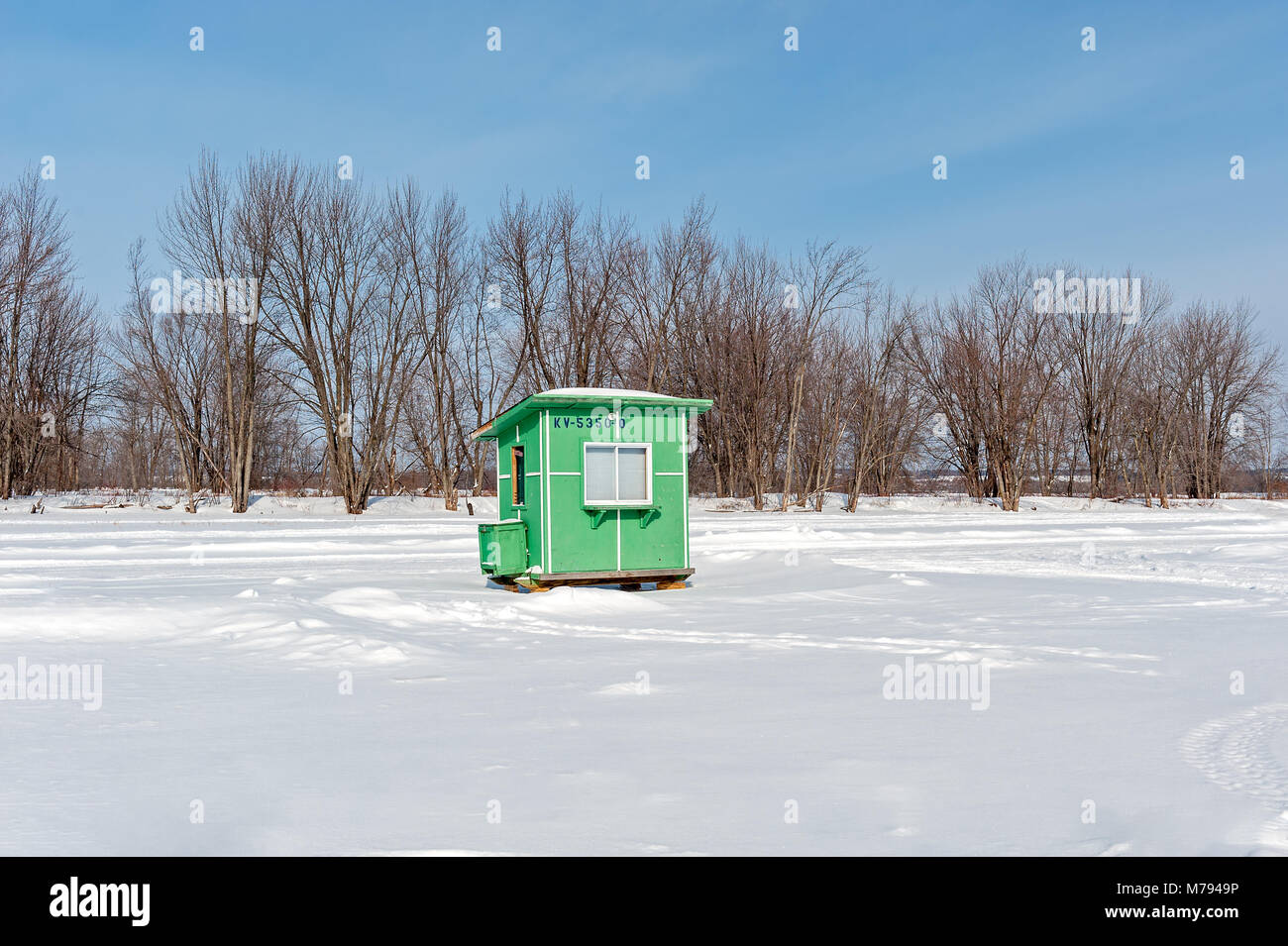Green ice fishing hut on the frozen Ottawa River Stock Photo