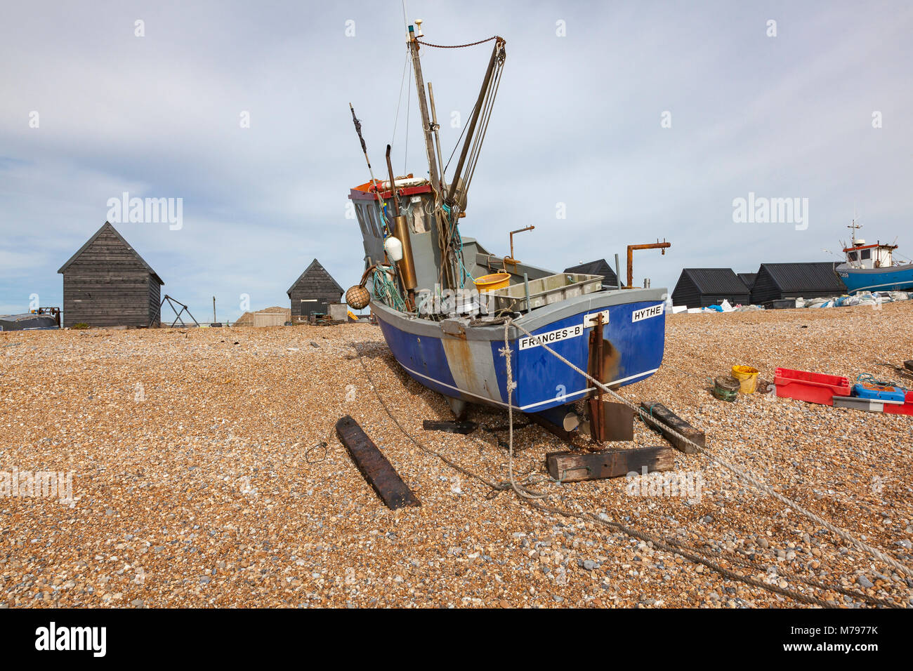 Fishing boats beached on the steep shingle beach at Hythe, Kent, UK ...