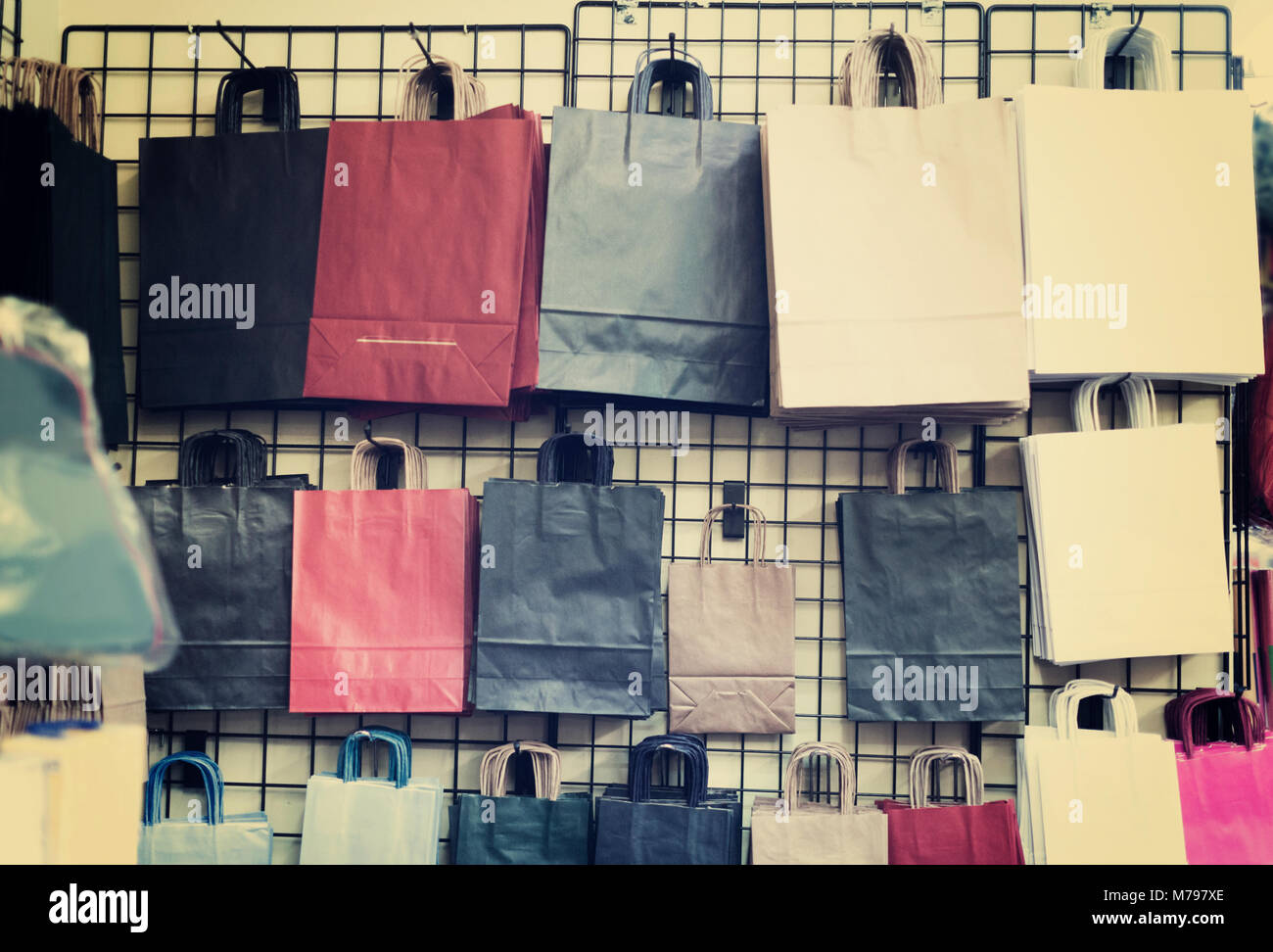 Colored packs is hanging on the stand in the store Stock Photo - Alamy