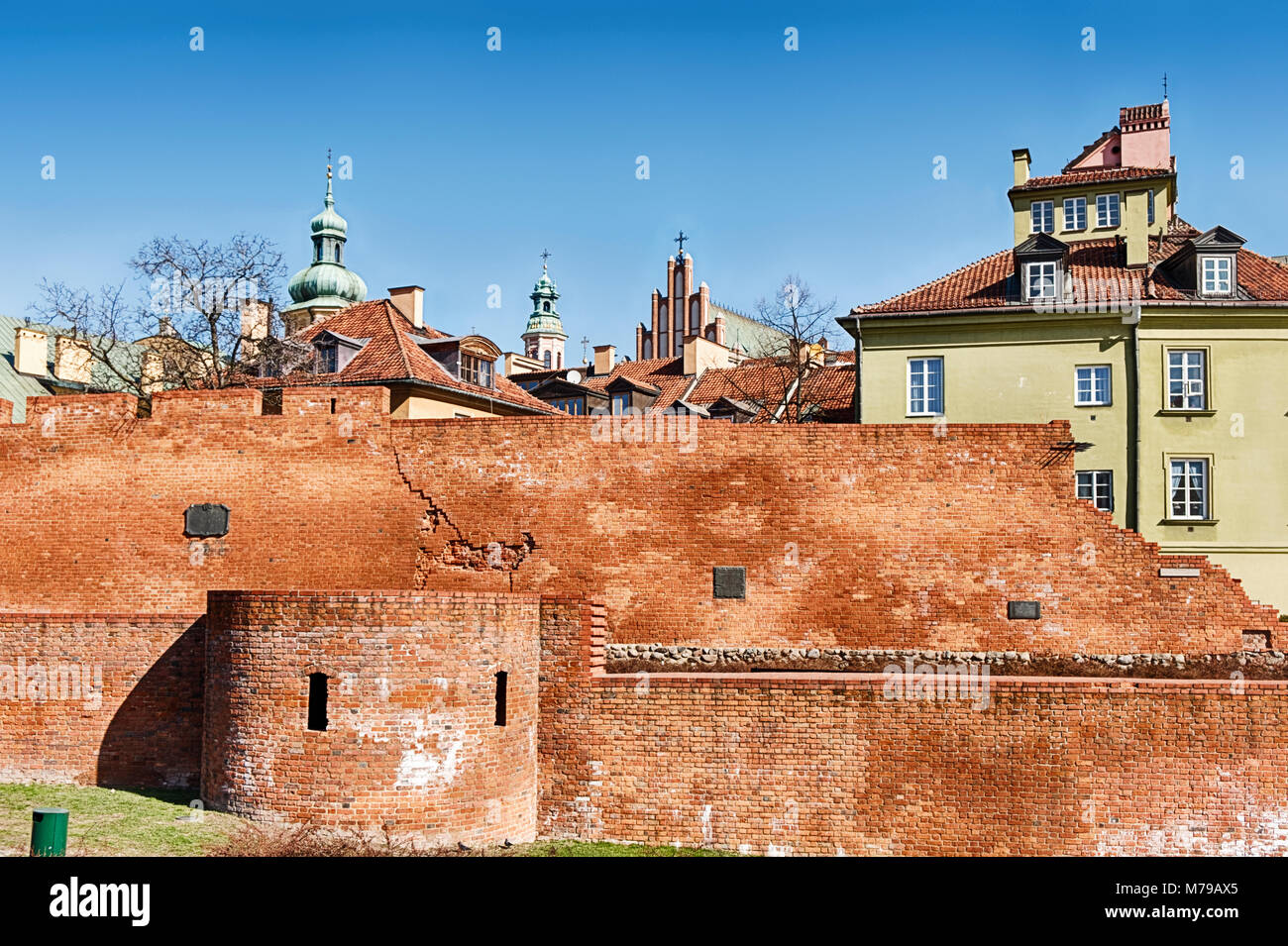 The brick outer wall that surrounds a portion of the Old Town of Warsaw, Poland is one of the few architectural elements that survived the destruction Stock Photo