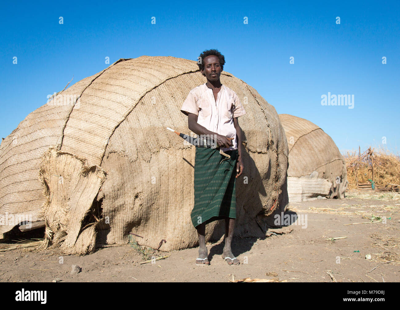 Afar tribe man in front of his hut, Afar region, Afambo, Ethiopia Stock Photo