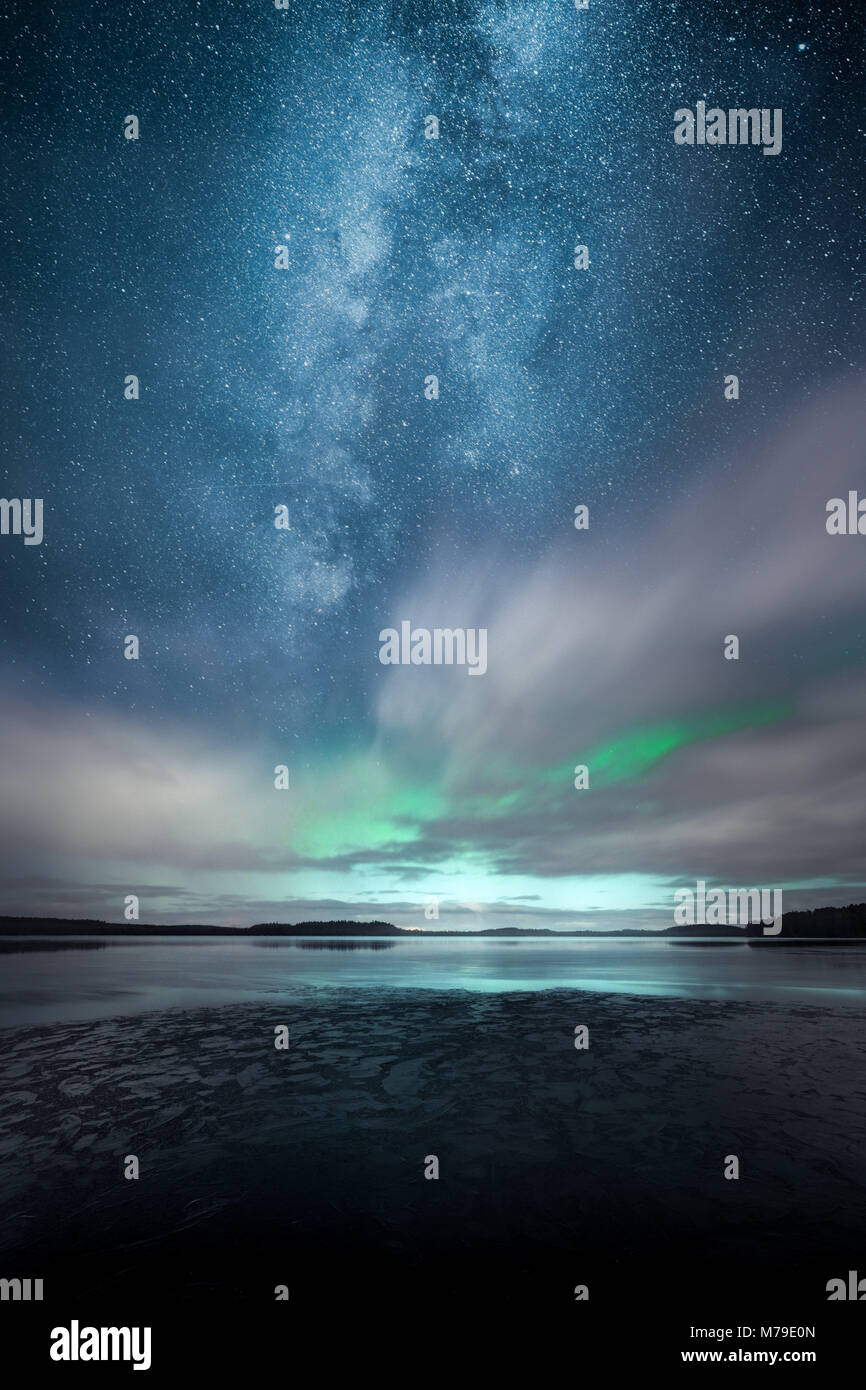 Northern Lights aka Aurora Borealis behind fast moving clouds with