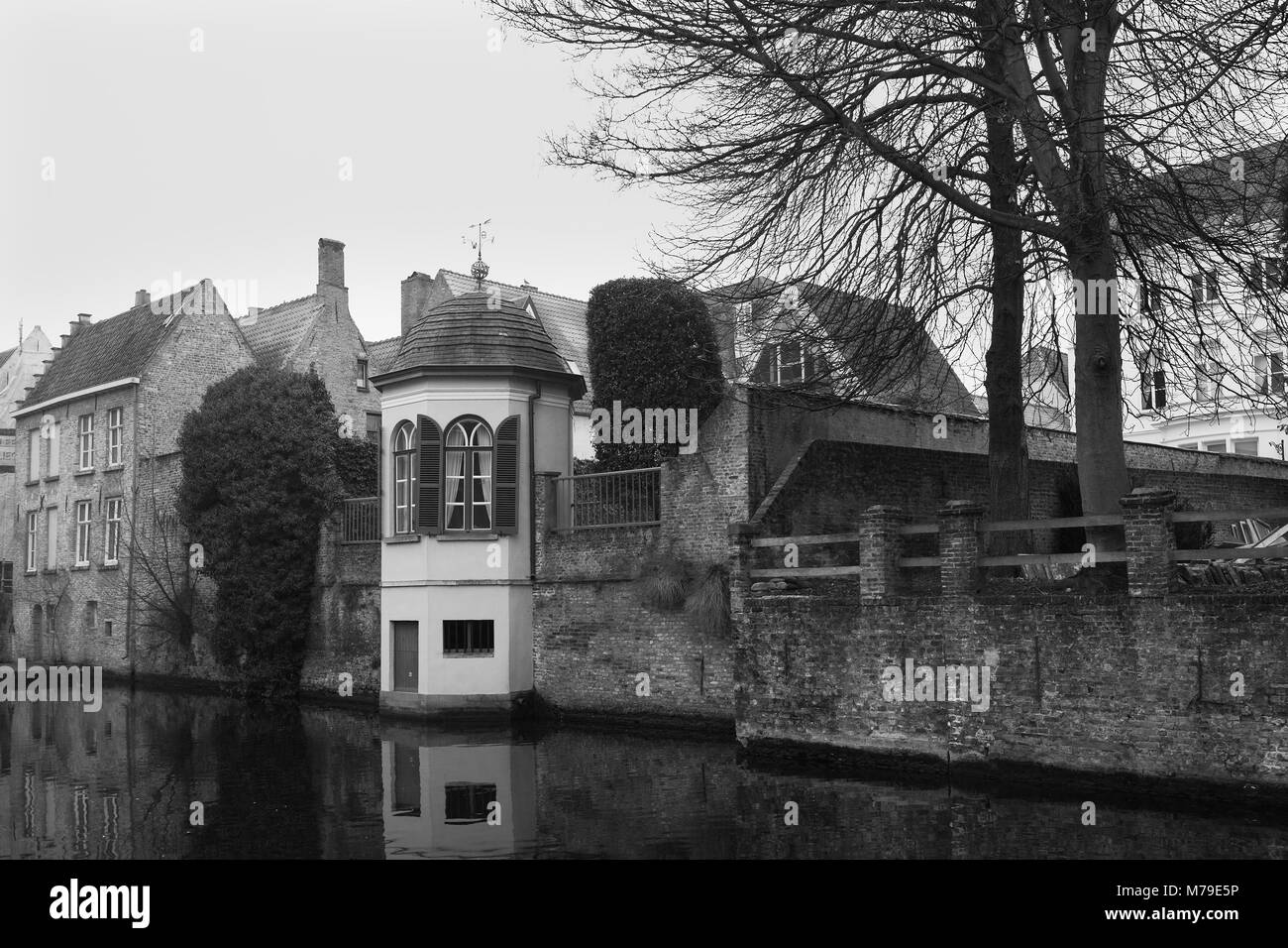 Pretty little octagonal summer house by the canal, Groenerei, Brugge, Belgium.  Black and white film photograph Stock Photo