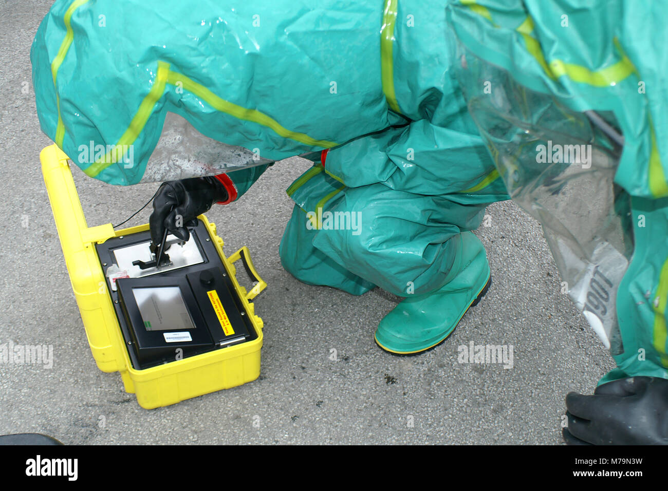 chemical warfare, Hazmat crew testing chemicals to identify Hazardous substance in emergency incident hot zone, chemical incident Stock Photo