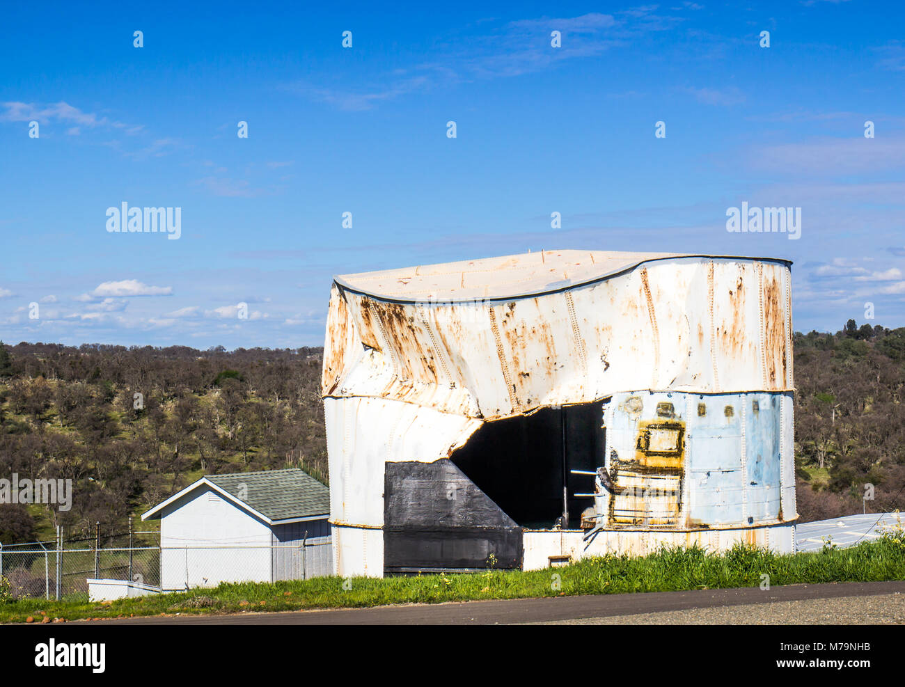 Old Rusty Water Tank With Side Ripped Open Stock Photo Alamy