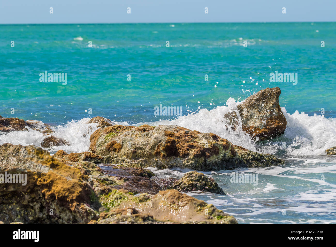 Ocean vs Rocks Stock Photo - Alamy