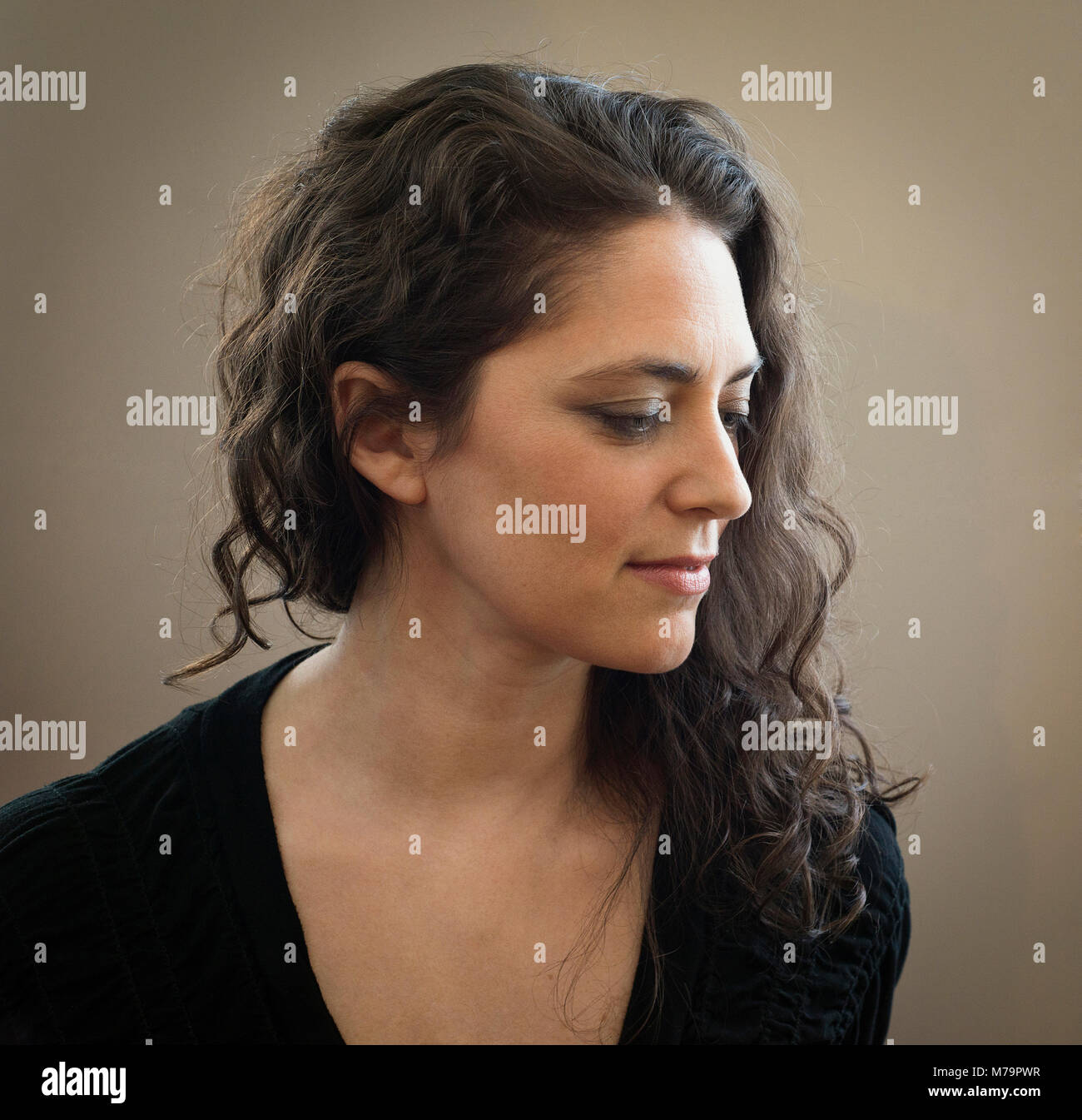Woman long curly brown hair hi-res stock photography and images - Alamy
