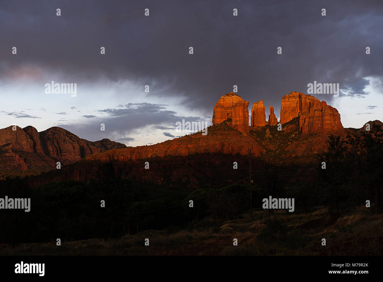 A landscape photograph of storm clouds moving in over Cathedral Rock in Sedona Arizona. Stock Photo