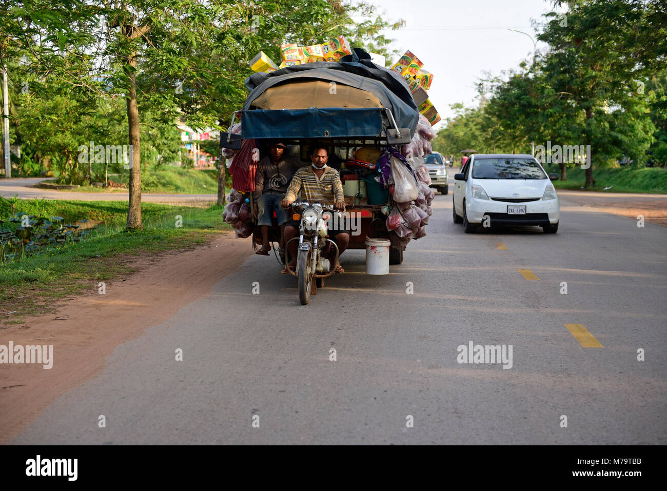 Cambodia, Itinerant salesman and selective sorting wastes Stock Photo