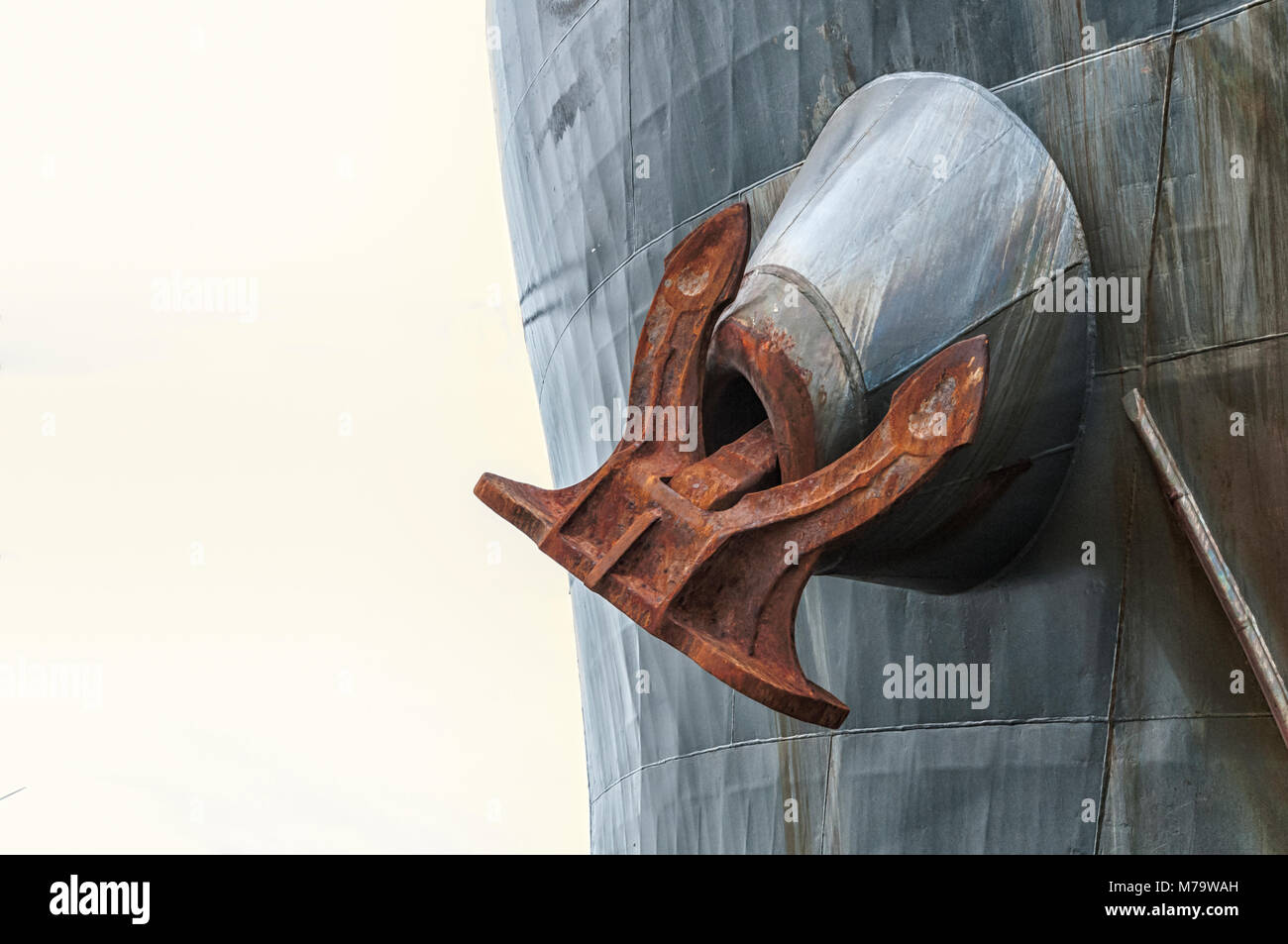 a huge ship's anchor hanging from a tanker Stock Photo