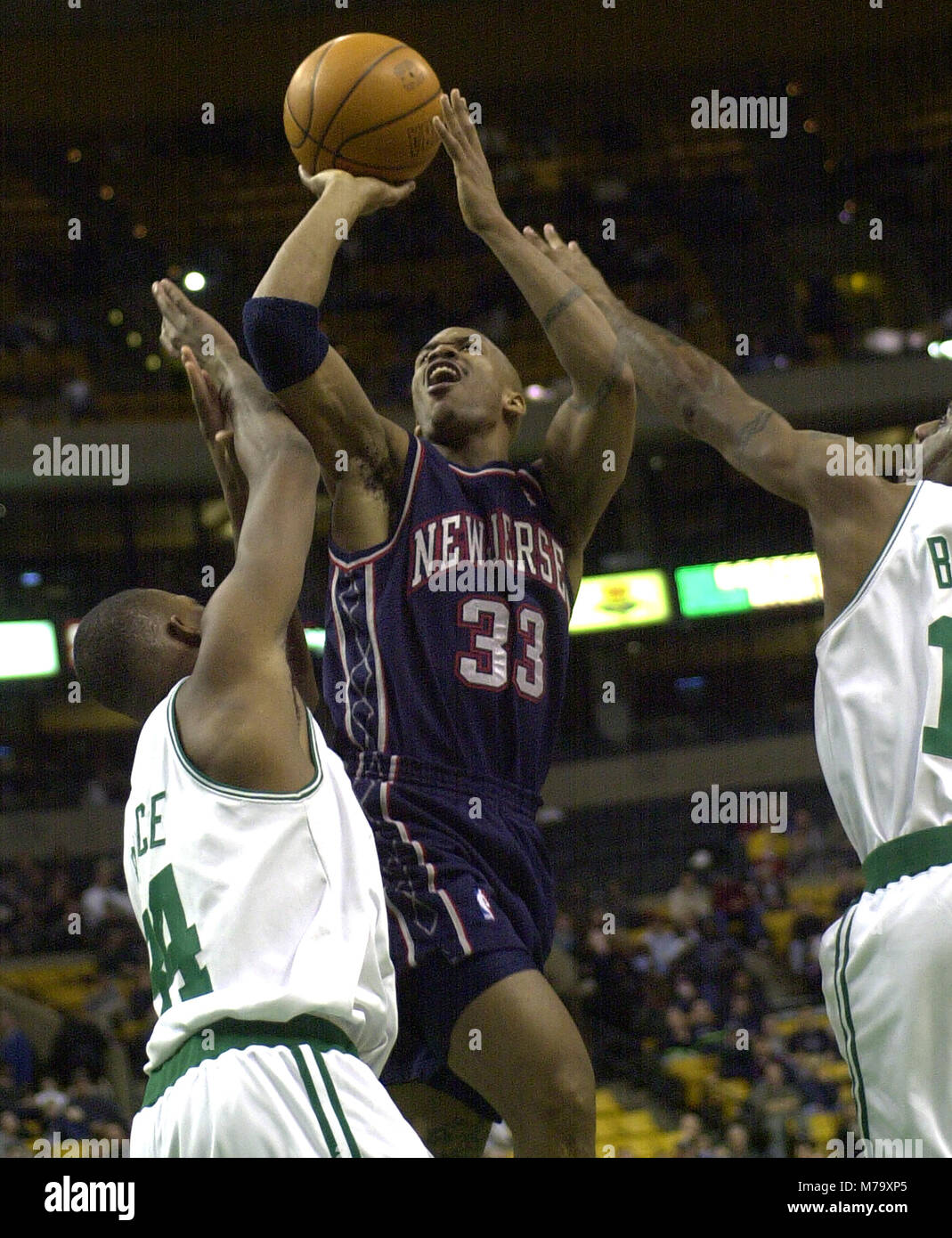 New Jersey Nets #33 Stephon Marbury scores on Boston Celtics #34 Paul Pierce  in game action at the Fleet Center in Boston Ma, USA Dec 20,2000 bill  belknap Stock Photo - Alamy