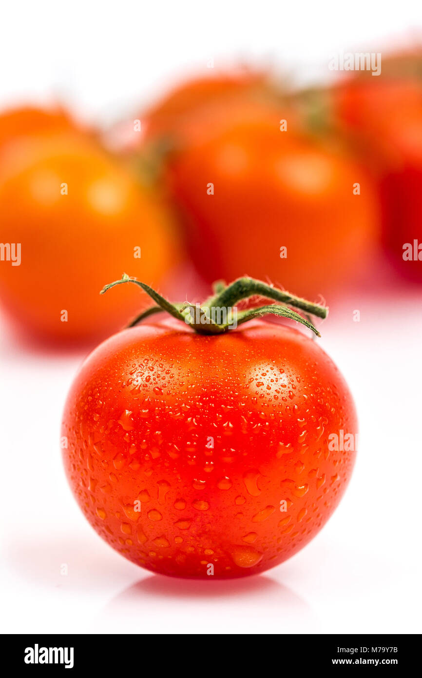 Tomato with water drops isolated on white background Stock Photo - Alamy