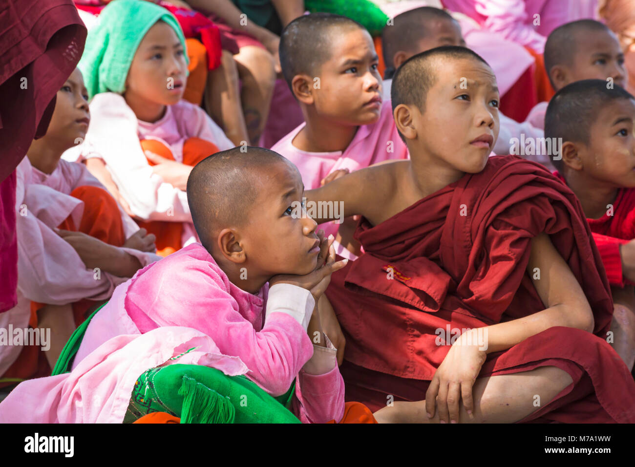 children's faces watching television at Aung Myae Oo Monastic Free Education School, Sagaing, Mandalay, Myanmar (Burma), Asia in February Stock Photo