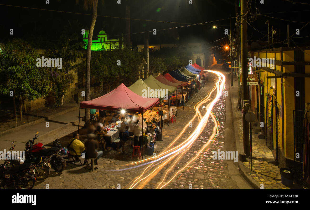 Village Street Food Vendors and Light Trails Stock Photo - Alamy