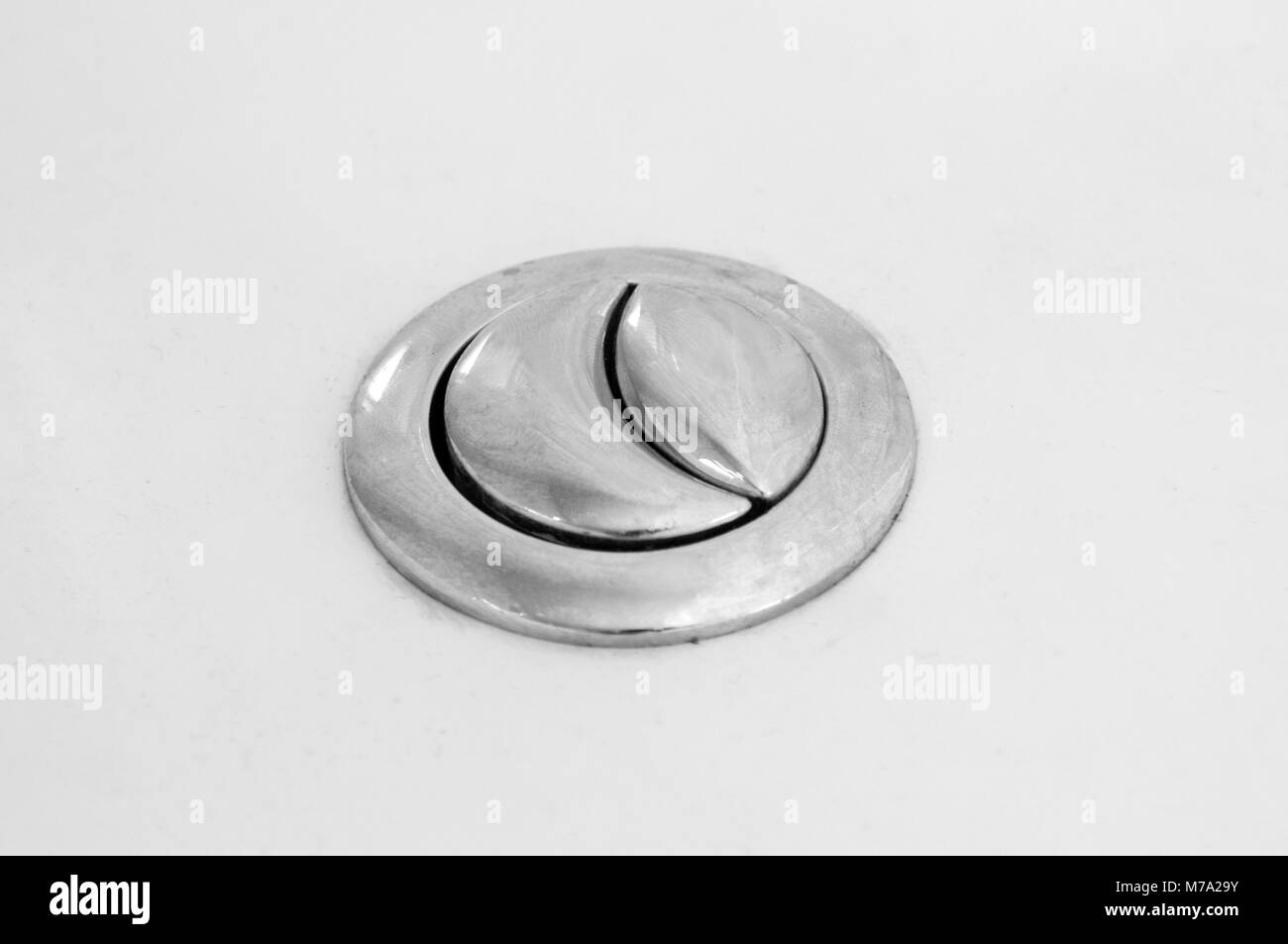 Toilet flushing buttons closeup Stock Photo Alamy