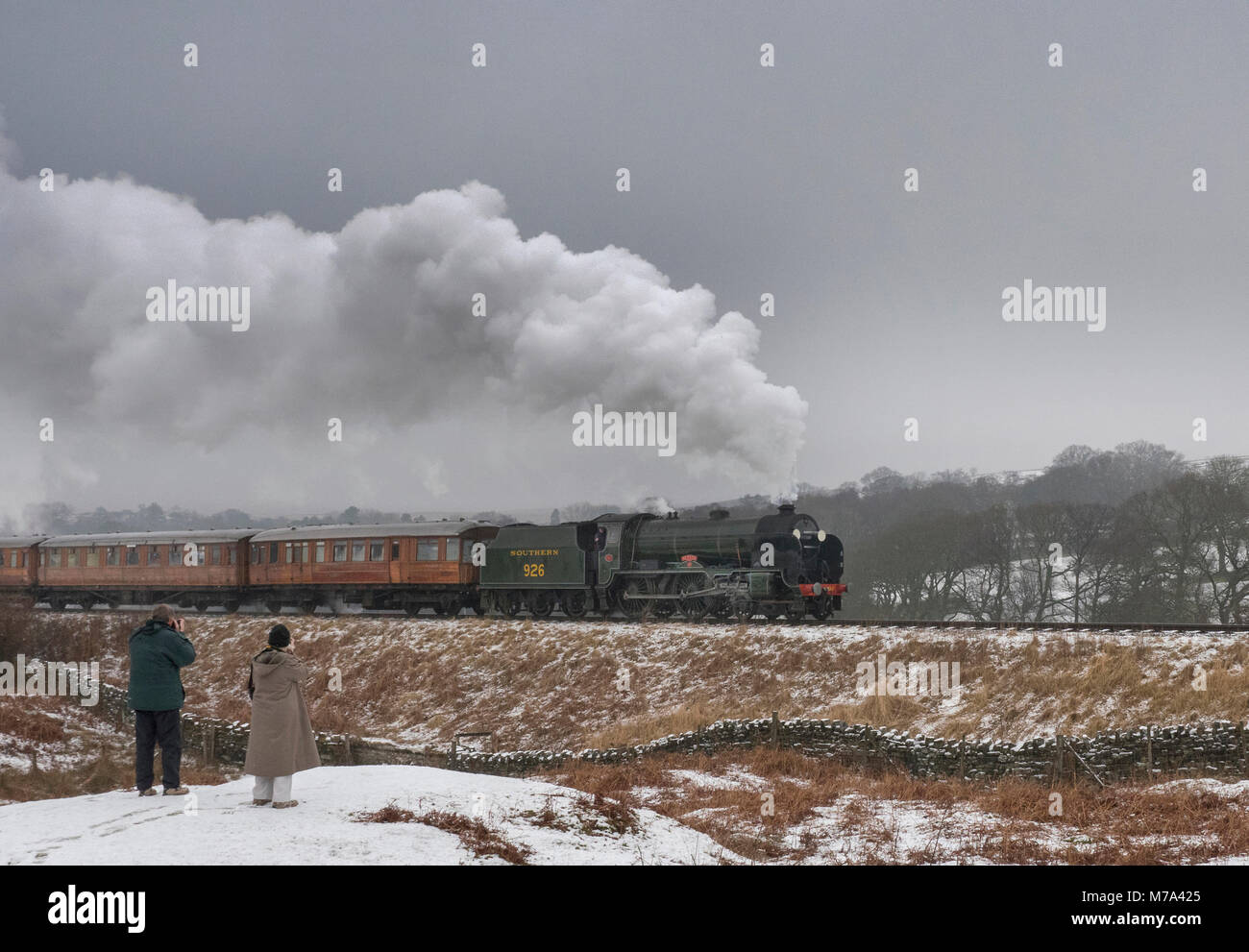North Yorks Moors Railway. Train enthusiasts watch steam locomotive :Repton pulling train to Pickering Yorkshire UK Stock Photo