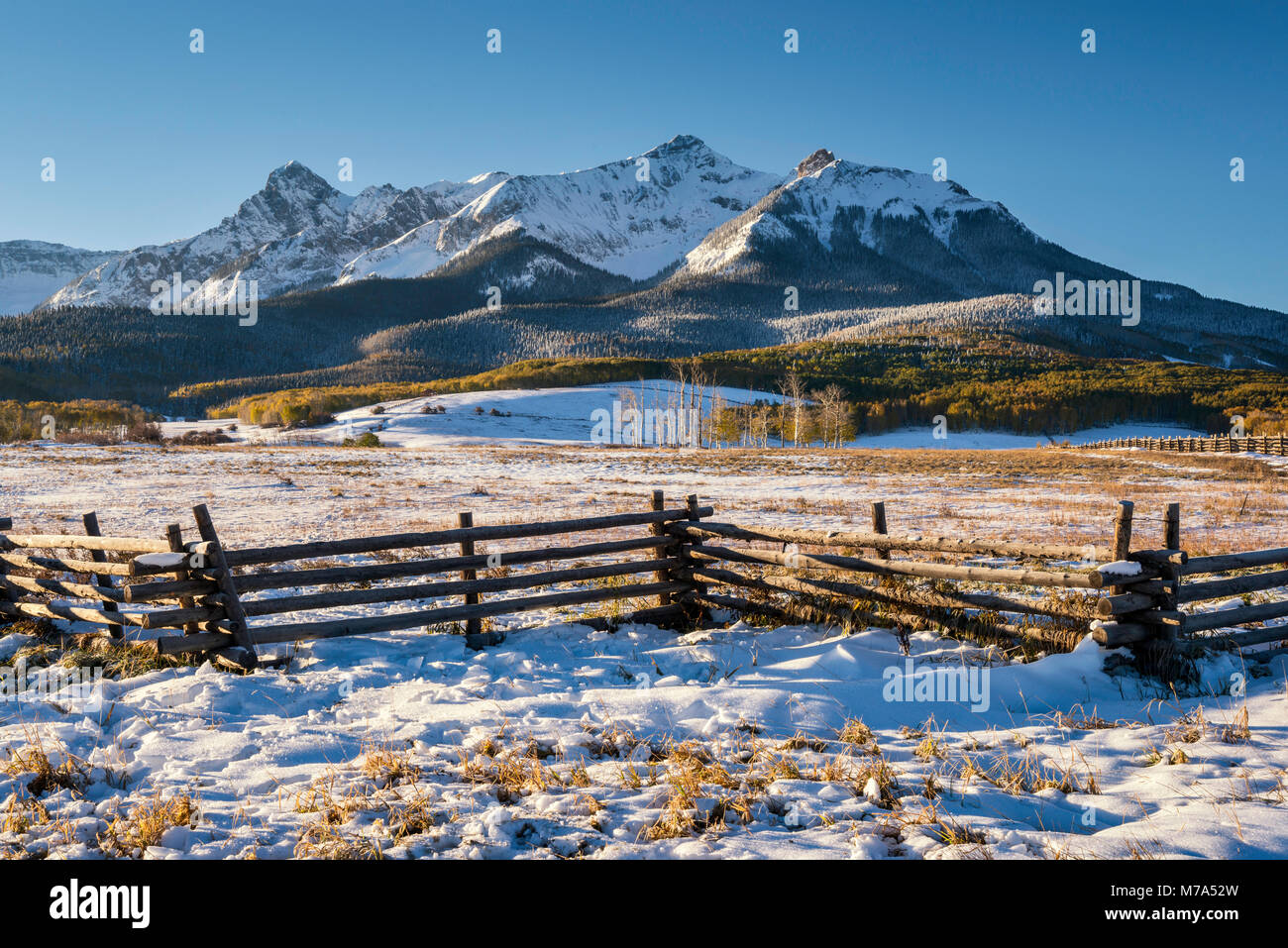 North Pole Peak and Hayden Peak, Sneffels Range, zigzag fence, snow in late fall, at sunrise from Last Dollar Road, San Juan Mountains, Colorado, USA Stock Photo