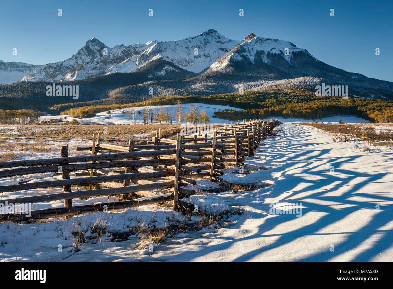 North Pole Peak and Hayden Peak, Sneffels Range, zigzag fence, snow in late fall, at sunrise from Last Dollar Road, San Juan Mountains, Colorado, USA Stock Photo