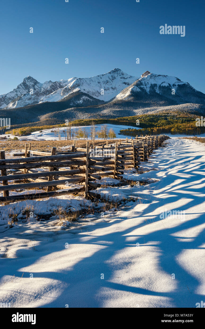 North Pole Peak and Hayden Peak, Sneffels Range, zigzag fence, snow in late fall, at sunrise from Last Dollar Road, San Juan Mountains, Colorado, USA Stock Photo