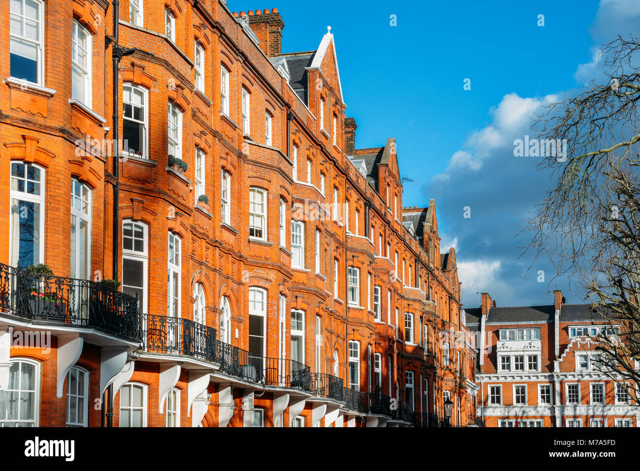 Expensive Edwardian block of period red brick apartments typically found in  Kensington, West London, UK Stock Photo - Alamy