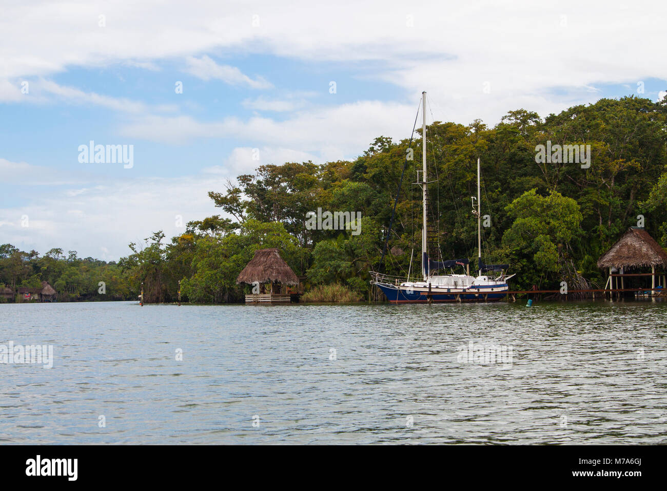 Yacht docked on the shore of Rio Dulce, Guatemala Stock Photo Alamy