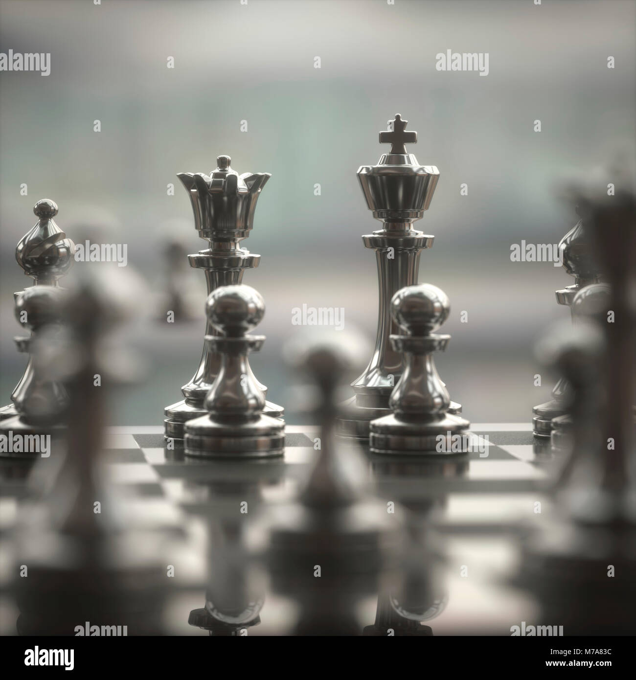 Horizontal shot of cool silver chess pieces in the starting position  reflected on the board Stock Photo by wirestock