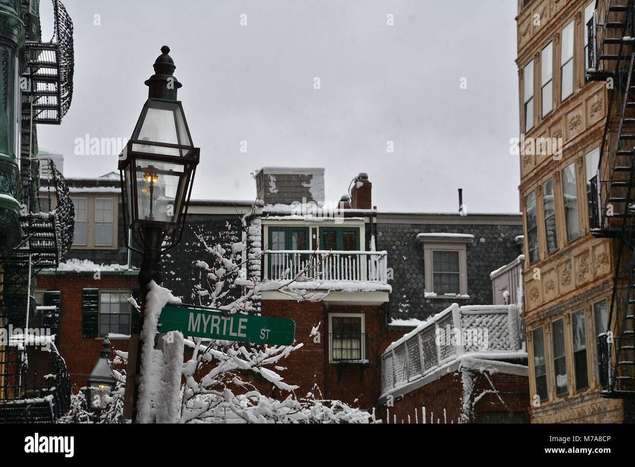 Brick homes and gas street lamps in Beacon Hill in downtown Boston after a Nor'Easter storm