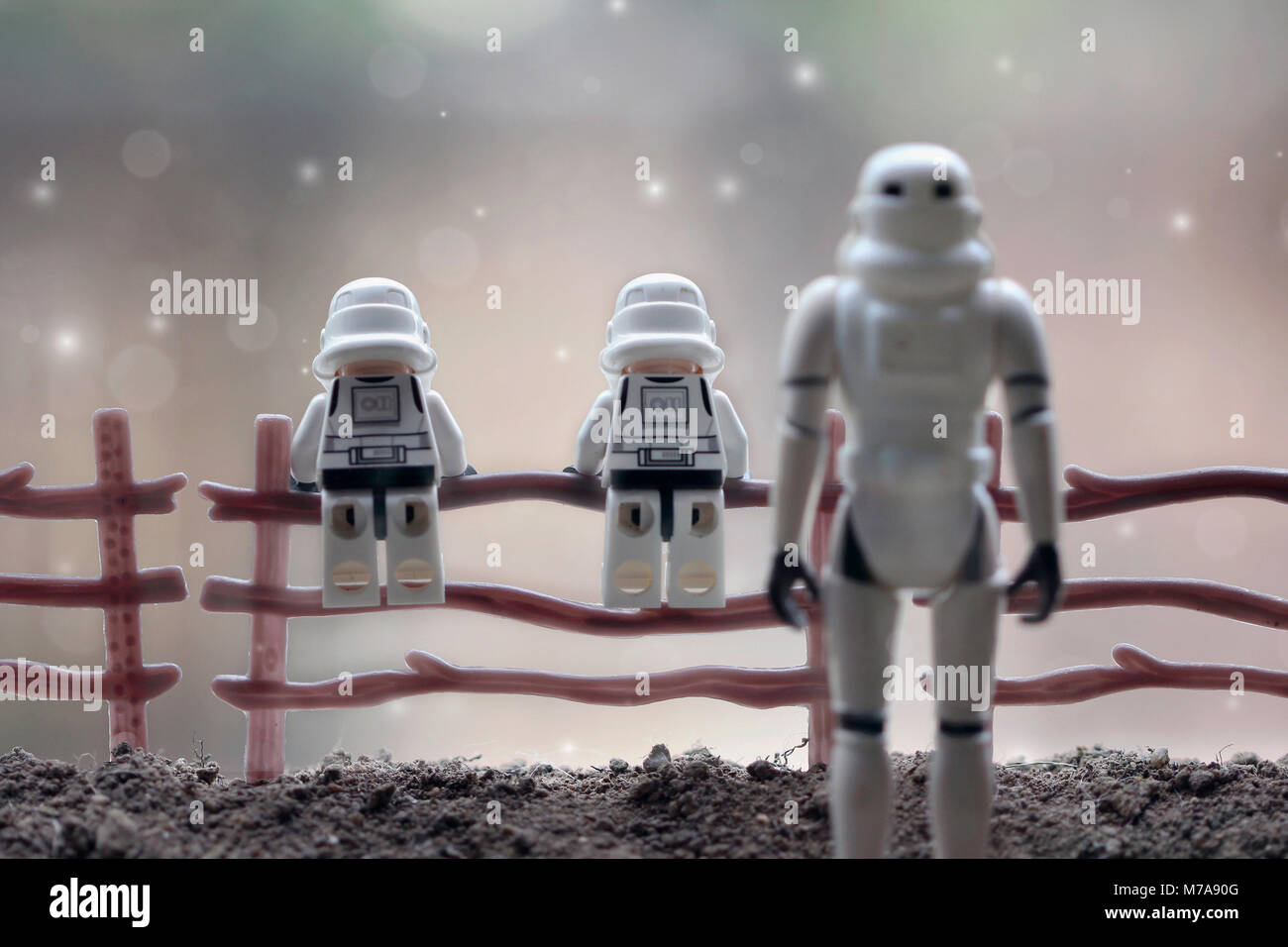 Lego Stormtrooper and Star Wars Stormtrooper action figure father and sons scene. Stock Photo