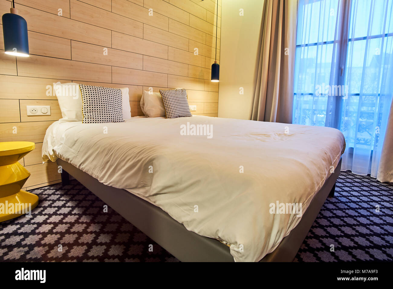 Cosy Modern Hotel Room for A Good Night Of Sleep Stock Photo