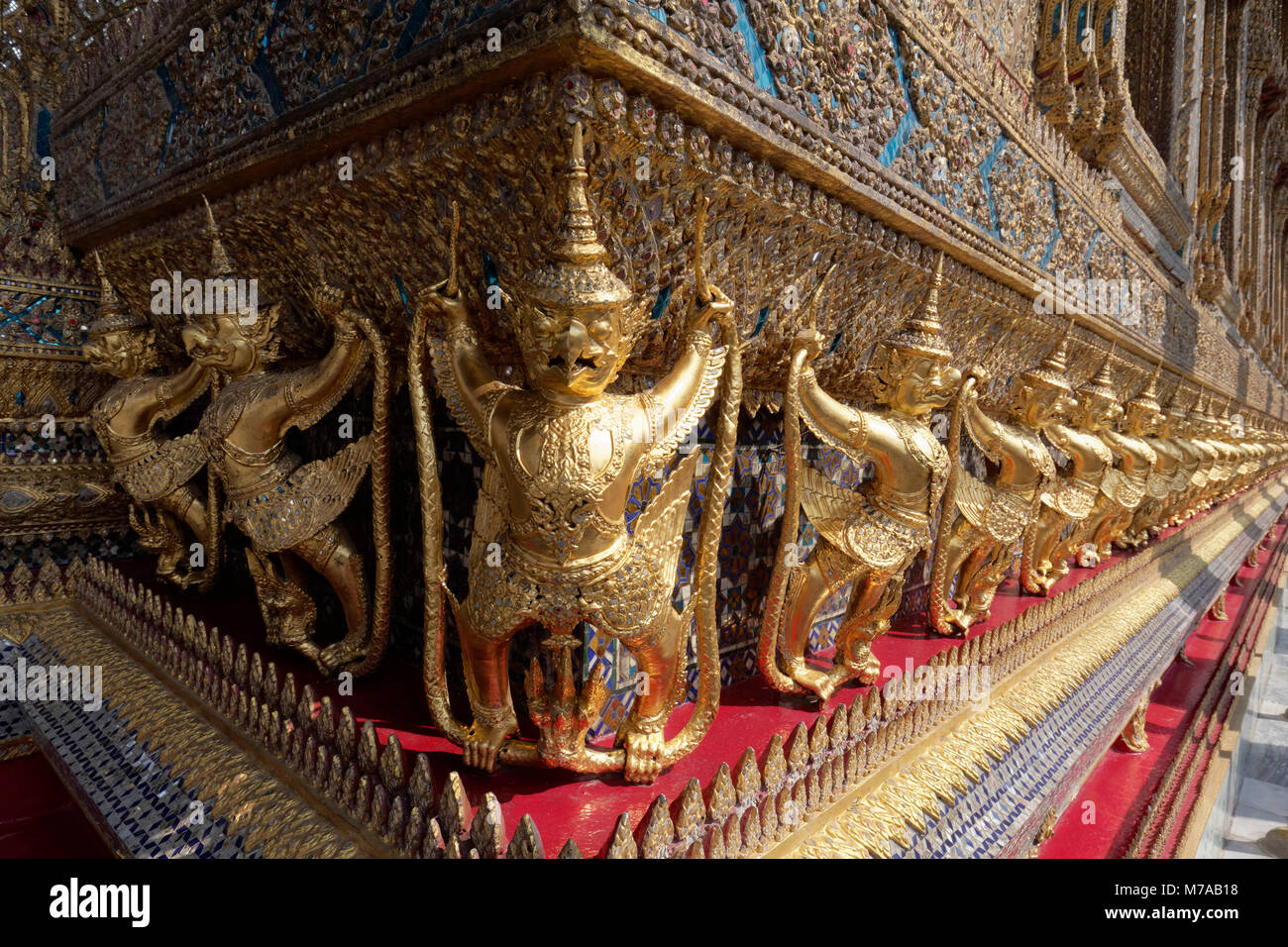 Garuda with Nagas, gilded figures, Ubosot Gallery, Emerald Buddha Temple, Wat Phra Kaeo, Ko Ratanakosin, Bangkok, Thailand Stock Photo