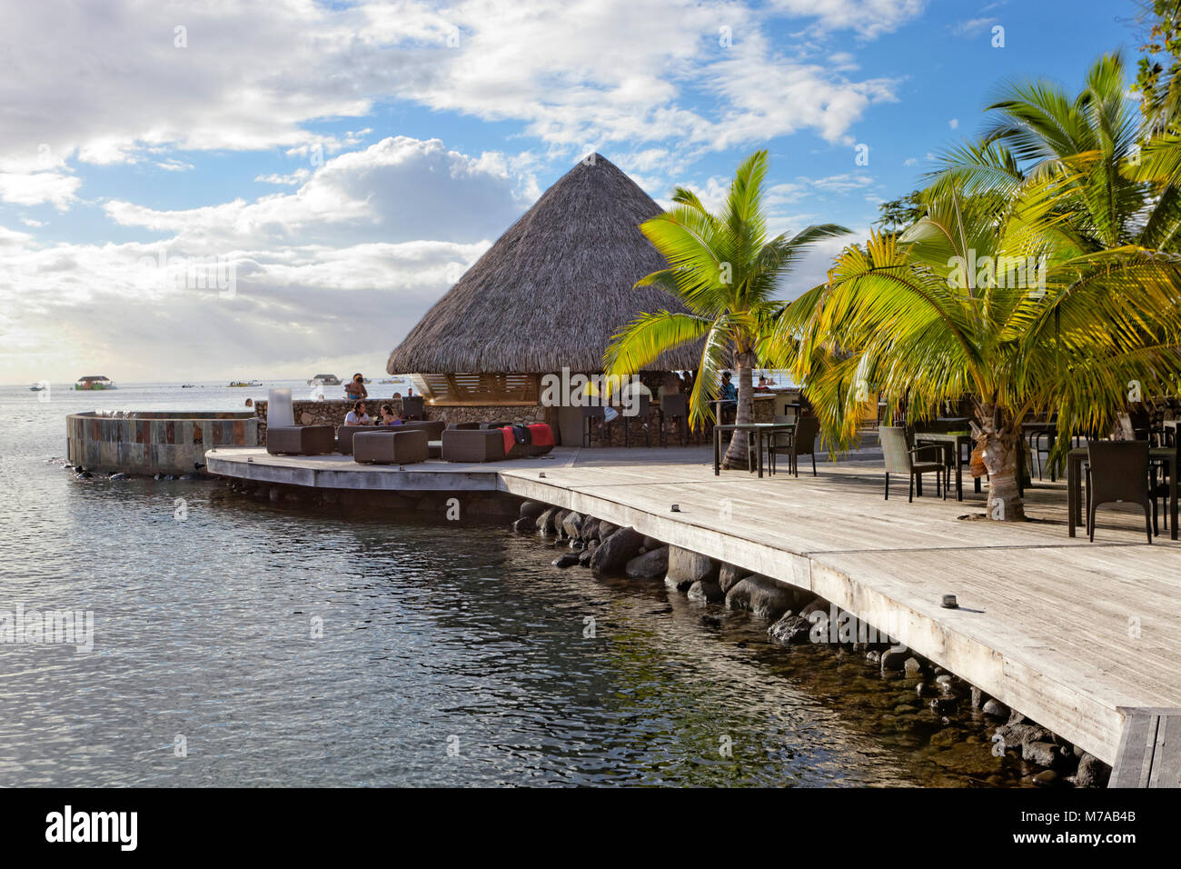 Beach bar, Palm trees, Sea, Pacific Ocean, Manava Suite Resort, Tahiti, Society Islands, Windward Islands, French Polynesia Stock Photo