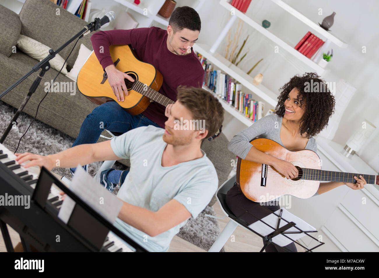 People playing musical instruments hi-res stock photography and images -  Alamy