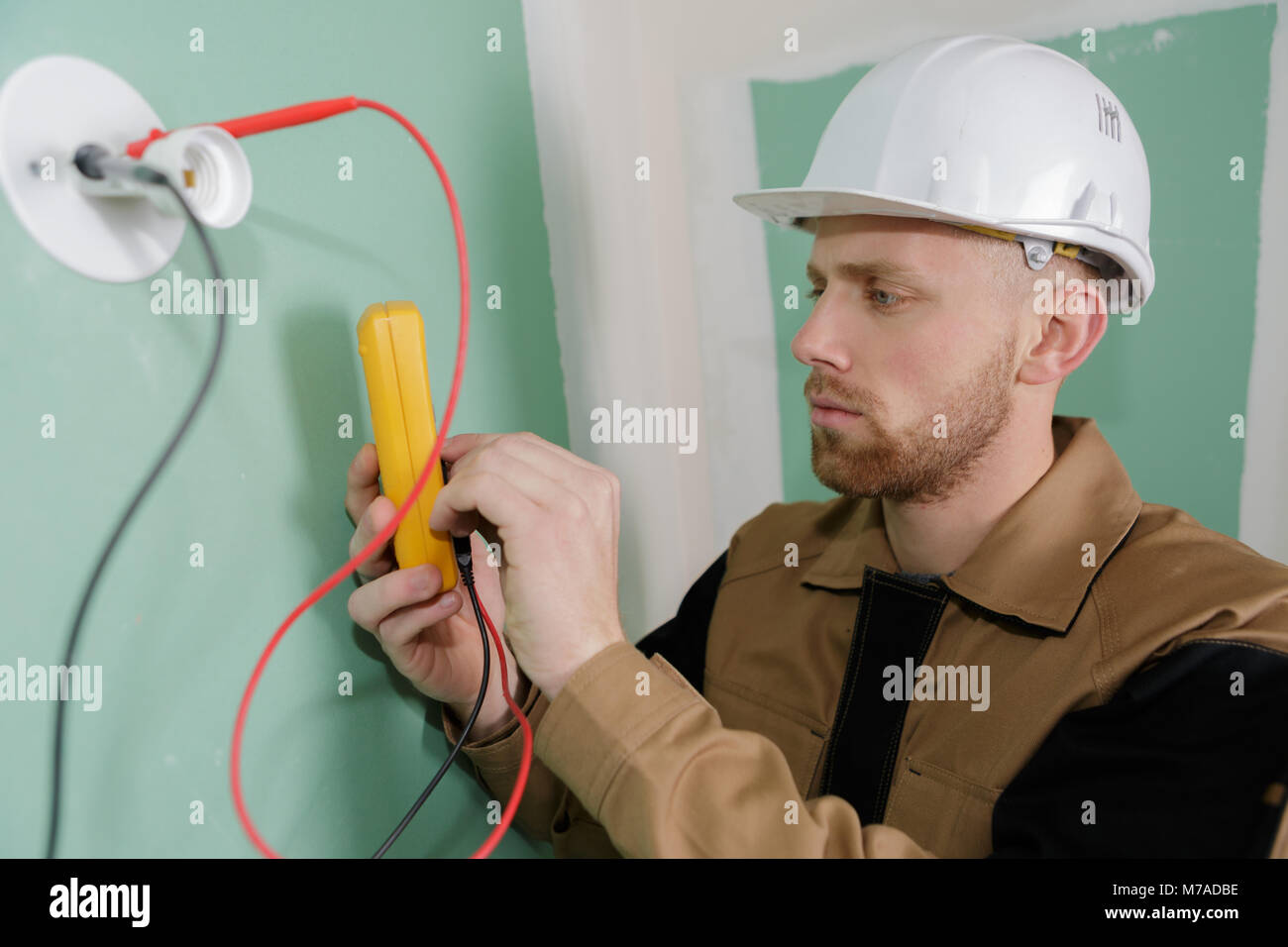 electrician testing the power voltage of a line Stock Photo Alamy
