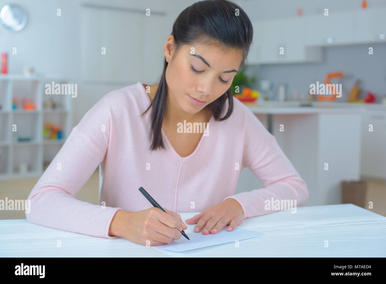female writing a letter Stock Photo - Alamy
