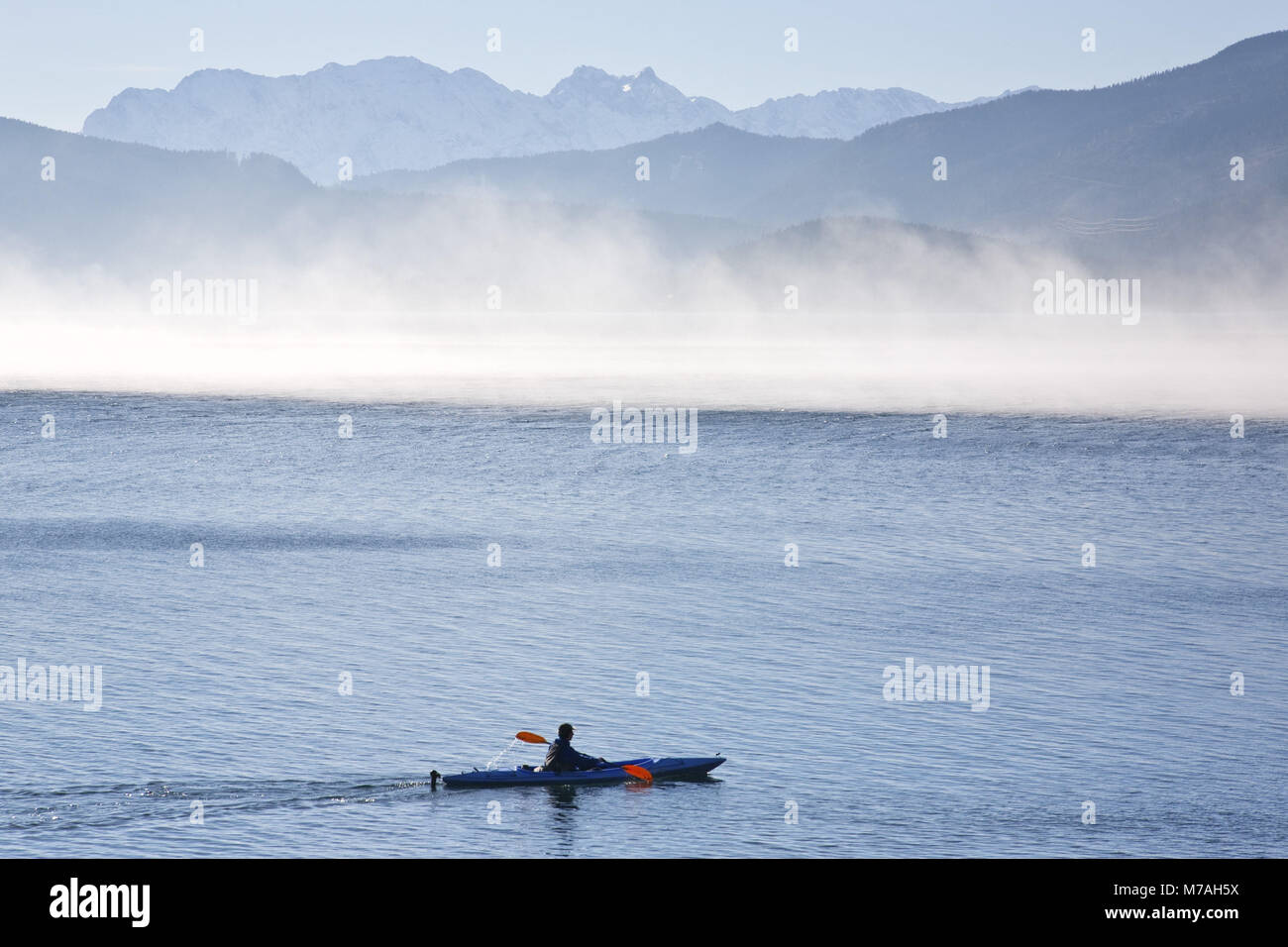Canoe driver on the Walchensee with fog, Bavarians, Germany, Stock Photo
